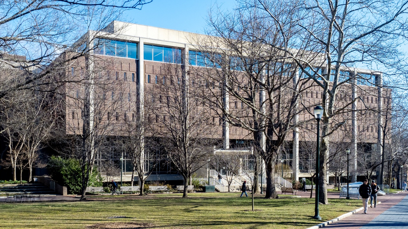 Van Pelt Library across College Green, with its long brick-and-concrete façade framed by leafless trees